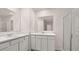 Bathroom with double sink vanity, large mirrors, and walk-in shower at 440 Reflection Dr # 16, Stockbridge, GA 30281