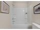 Bright bathroom with white tub and neutral paint at 1118 Edinberg Dr # 60, Villa Rica, GA 30180