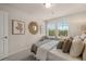 Cozy bedroom featuring natural light from two windows and a decorative mirror at 1118 Edinburg Dr # 60, Villa Rica, GA 30180