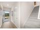 Bright entryway showcasing wood flooring and stairs with carpet runners, creating a seamless transition between floors at 1118 Edinburg Dr # 60, Villa Rica, GA 30180