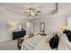 Bright primary bedroom with a view of the ensuite bathroom, a tray ceiling, and plenty of sunlight at 1118 Edinberg Dr # 60, Villa Rica, GA 30180