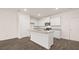 Bright, white kitchen featuring granite countertops, stainless steel appliances and hardwood floors at 448 Reflection Dr # 18, Stockbridge, GA 30281