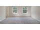 Bedroom with carpet and a double window at 4524 Ajo Walk, Atlanta, GA 30331