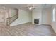 Inviting living room featuring a fireplace, wood-look flooring, and lots of natural light at 4524 Ajo Walk, Atlanta, GA 30331