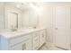 Bathroom featuring double vanity and white cabinets at 4671 Larkfield Way, Powder Springs, GA 30127