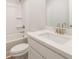 Bathroom with a white vanity, sink, and a tub/shower combo with a white surround at 4671 Larkfield Way, Powder Springs, GA 30127