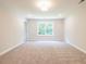 Well-lit carpeted bedroom at 4671 Larkfield Way, Powder Springs, GA 30127