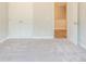 Bedroom featuring soft gray carpet and an open door to a closet at 4671 Larkfield Way, Powder Springs, GA 30127