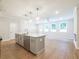 Modern kitchen island featuring stainless steel appliances and open to the living space at 4671 Larkfield Way, Powder Springs, GA 30127