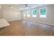 Bright living area with three large windows offering natural light and luxury vinyl plank flooring at 4671 Larkfield Way, Powder Springs, GA 30127