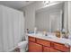 Bathroom with a shower/tub combination and cherry vanity at 1531 Autumn Wood Trl, Buford, GA 30518
