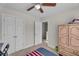 Bedroom featuring carpet, ceiling fan, and closet at 1531 Autumn Wood Trl, Buford, GA 30518