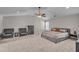 Bedroom featuring neutral walls, carpet, ceiling fan and bedroom furniture at 1531 Autumn Wood Trl, Buford, GA 30518
