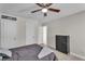 This bedroom features neutral walls, two large closets, a ceiling fan, and an adjoining room at 1531 Autumn Wood Trl, Buford, GA 30518