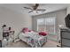 Bright bedroom with carpet, ceiling fan, and natural light at 1531 Autumn Wood Trl, Buford, GA 30518