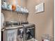 Convenient laundry room with front-load washer and dryer at 1531 Autumn Wood Trl, Buford, GA 30518