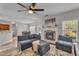Inviting living room with fireplace, ceiling fan and comfortable seating at 1531 Autumn Wood Trl, Buford, GA 30518