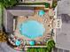 Aerial view of a community pool with lounge chairs and umbrellas at 2700 Pine Tree Ne Rd # 1117, Atlanta, GA 30324