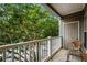 Balcony with seating and a lush green view with trees at 2700 Pine Tree Ne Rd # 1117, Atlanta, GA 30324