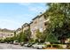 Exterior view of a well-kept apartment building with private balconies and ample parking at 2700 Pine Tree Ne Rd # 1117, Atlanta, GA 30324
