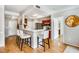 Stylish kitchen with modern bar seating, stainless steel appliances, and hardwood floors at 2700 Pine Tree Ne Rd # 1117, Atlanta, GA 30324