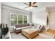 Relaxing living room area with a sectional couch, window, hardwood floors, and neutral decor at 2700 Pine Tree Ne Rd # 1117, Atlanta, GA 30324