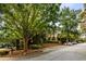 Well-maintained parking area with assigned spaces surrounded by mature trees and landscaping at 2700 Pine Tree Ne Rd # 1117, Atlanta, GA 30324