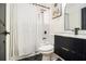 Updated bathroom with a black vanity, subway tile shower, and black and white accents at 3388 Hyland Dr, Decatur, GA 30032