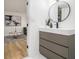 Basement bathroom with sleek gray vanity and modern fixtures at 3388 Hyland Dr, Decatur, GA 30032