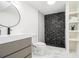 Modern bathroom with striking black shower tile and built-in shelving at 3388 Hyland Dr, Decatur, GA 30032