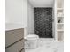 Modern bathroom with striking black shower tile and built-in shelving at 3388 Hyland Dr, Decatur, GA 30032