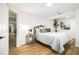Cozy bedroom with wood floors, a modern bed frame, and plenty of natural light at 3388 Hyland Dr, Decatur, GA 30032