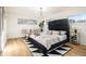 Stylishly designed bedroom featuring hardwood floors, modern furniture, and windows with natural light at 3388 Hyland Dr, Decatur, GA 30032
