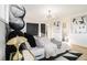 Modern bedroom featuring a statement headboard, black and white decor, and hardwood floors at 3388 Hyland Dr, Decatur, GA 30032