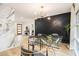 Dining room with modern light fixture, adjacent to the living room at 3388 Hyland Dr, Decatur, GA 30032