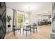 Stylish dining area with a large window and contemporary furnishings at 3388 Hyland Dr, Decatur, GA 30032