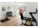 Bright exercise room with light wood flooring and door to the outdoor patio at 3388 Hyland Dr, Decatur, GA 30032