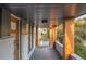 View of the home's covered front porch with natural wood columns at 3388 Hyland Dr, Decatur, GA 30032