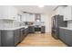 Updated kitchen showcasing two-tone cabinets, stainless steel appliances, and modern countertops at 3388 Hyland Dr, Decatur, GA 30032