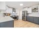 Spacious kitchen with stainless steel appliances, two-tone cabinets and stylish backsplash at 3388 Hyland Dr, Decatur, GA 30032