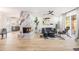 Bright living room featuring a marble fireplace, modern furniture, and large windows for plenty of natural light at 3388 Hyland Dr, Decatur, GA 30032