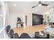 Open floor plan features a marble fireplace, modern fan, and wood floors at 3388 Hyland Dr, Decatur, GA 30032