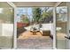 Charming outdoor patio with comfortable seating viewed through the French doors at 3388 Hyland Dr, Decatur, GA 30032