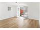 Bright room featuring light wood flooring, a window, and French doors leading to the exterior at 3388 Hyland Dr, Decatur, GA 30032
