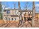 Exterior showcasing the backyard, deck, and the home's siding and stone foundation at 6739 Valley Ct, Douglasville, GA 30135