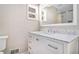 Bright bathroom featuring a marble countertop, modern fixtures, and updated vanity with extra storage at 6739 Valley Ct, Douglasville, GA 30135