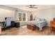 Bedroom with plenty of natural light, wood floors, and room for a workspace at 6739 Valley Ct, Douglasville, GA 30135