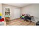 Functional bedroom space with wood floors, closet, and natural light at 6739 Valley Ct, Douglasville, GA 30135