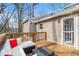 Relaxing deck with comfortable seating and a glass table at 6739 Valley Ct, Douglasville, GA 30135