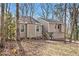 Charming home with fresh landscaping, mature trees, and a welcoming front entrance at 6739 Valley Ct, Douglasville, GA 30135